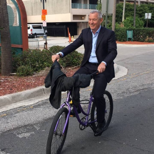 Igor Makarov riding a bicycle at an outdoor event