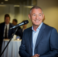 Igor Makarov delivering a speech at a business event